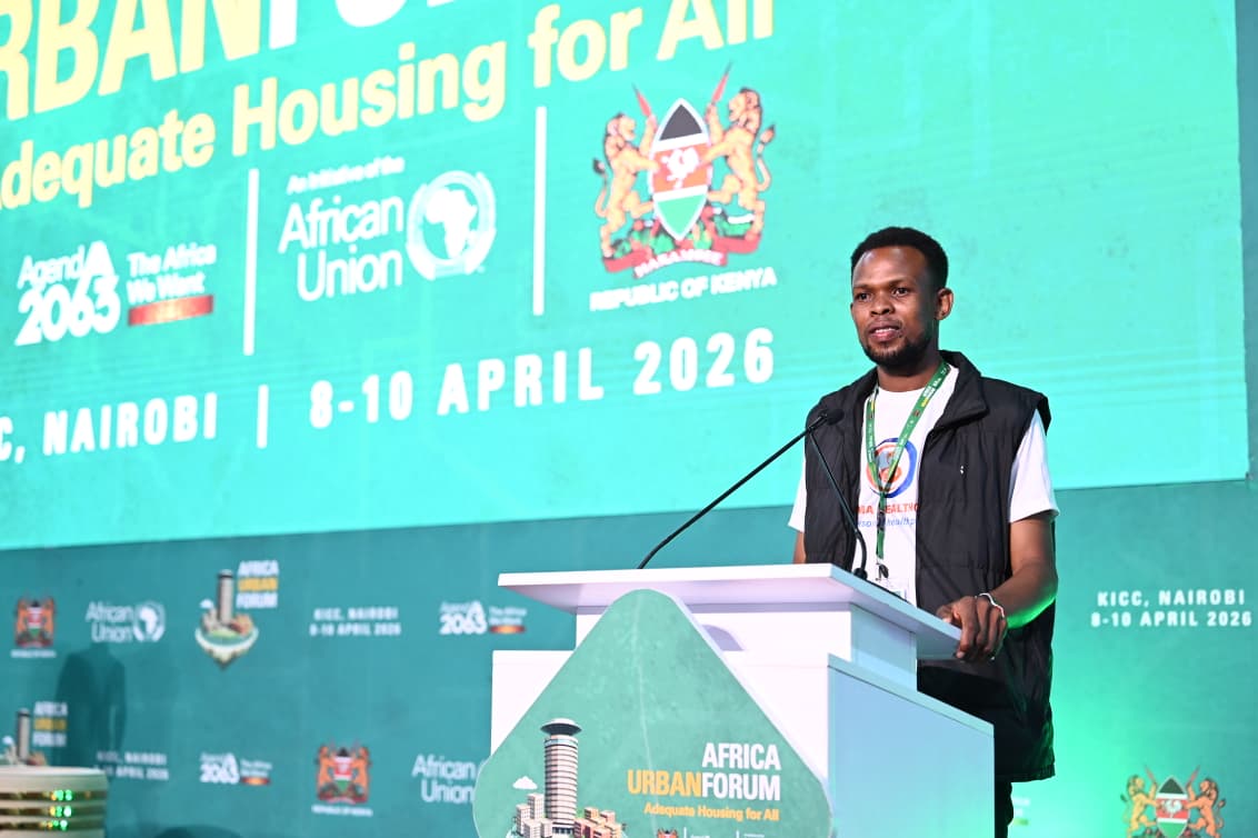 Teddy Jeremy speaking on stage at the Africa Urban Forum